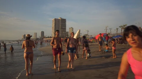 People at Crowded Beach. Camera Moves Forward Parallel to Coastline. 스톡 동영상 103335508