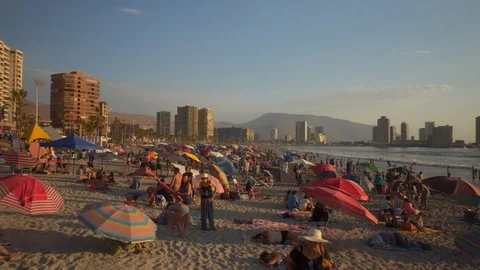 People at Crowded Beach. Camera Moves Forward Parallel to Coastline. 스톡 동영상 103336502