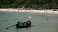 People on crowded beach on their swimming suits, sunbathing, crowd tanning HD Footage