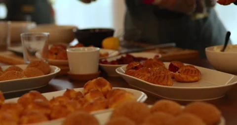 People at a culinary master class on profiteroles. People prepare profiteroles. Stock Footage 252188825