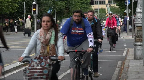 People cycle home from work on cycle path, city centre, Dublin, Ireland Stock Footage 53221825