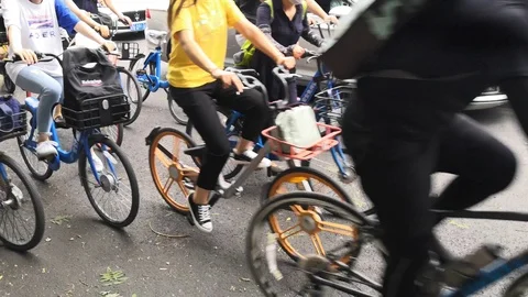 People cycle on the road after work Stock Footage 111742250