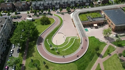 People Cycling on a Modern Cycle Path in Utrecht 動画素材 244401593