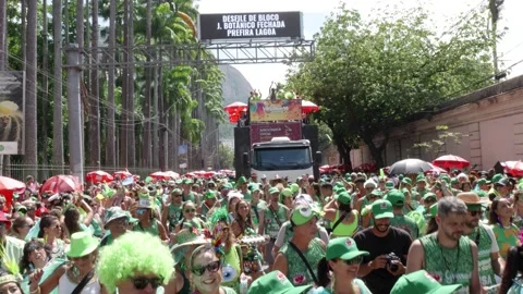 People dance and play instruments in a crowded Rio de Janeiro Carnaval street Stock Footage 336113056