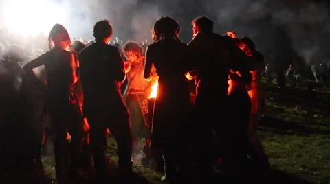 People Dance Around Fire Stock Footage 49997302