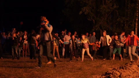 People dance around the fire Stock Footage 64957405