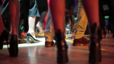 People Dance on the Dance Floor. Bottom View of Legs. Stock Footage 75614264