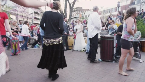People dancing and drummers during Drum circle - Friday evenings Asheville, NC Stock Footage 103433603
