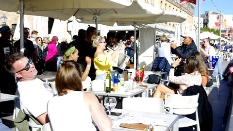 People dancing and having fun by latin music at a cafe Stock Footage 107559378