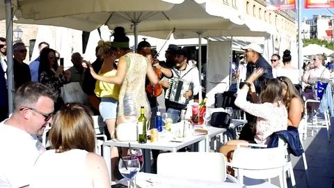 People dancing and having fun by latin music at a cafe Stock Footage 107559438