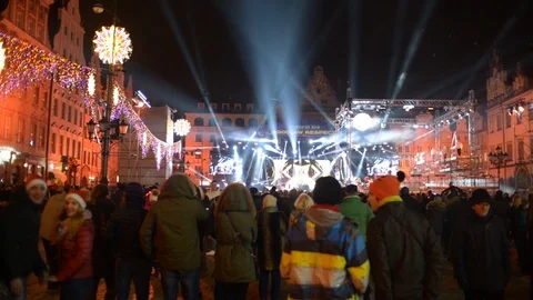 People Dancing and Light Show on a Christmas Concert in Wroclaw, Poland Stock Footage 100510062