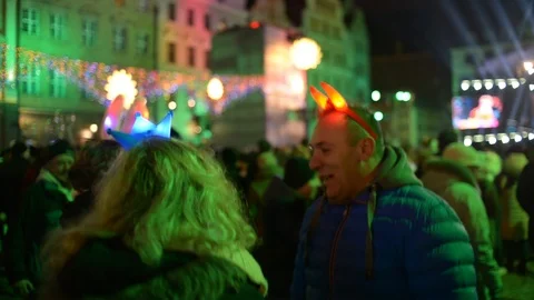 People Dancing and Light Show on a Christmas Concert in Wroclaw, Poland Stock Footage 100510112