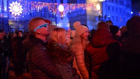 People Dancing and Light Show on a Christmas Concert in Wroclaw, Poland Stock Footage 100510174