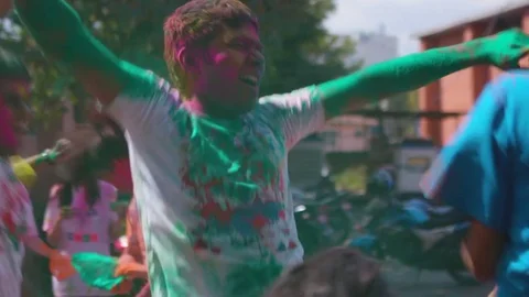 People dancing and playing with colors all over their body on Holi Stock Footage 77448025