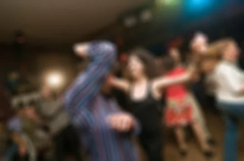 People dancing blur background Stock Photos