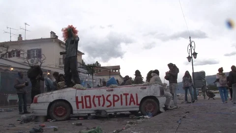 People dancing on a car at the flour wars festival Stock Footage 87618161
