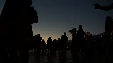 People dancing in the evening on the waterfront Stock Footage 71817890
