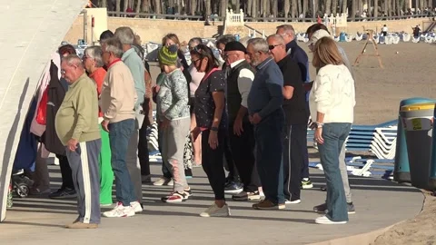 People dancing in a group together in benidorm city in spain Stock Footage 315034667