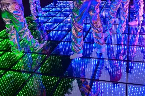 People dancing on LED dance floor Stock Photos