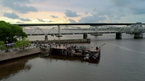 People dancing by the river at sunset Stock Footage 101943243