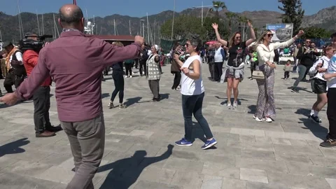 People dancing on the square in front of camera Stock Footage 173712775