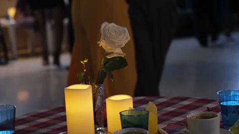 People dancing tango in the background. Focus on rose and candles. Stock Footage 205537460