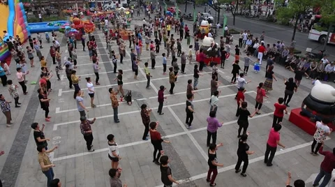 People dancing together on main square of Zhujiajiao water village in Shanghai Stock Footage 52238195