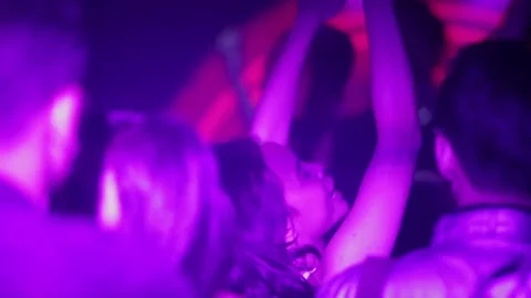 People dancing together in a night club. Silhouette Stock Footage