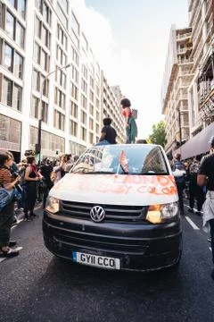 People Dancing on the top of the vam while Huge crowd of Black Lives Matters Stock Photos