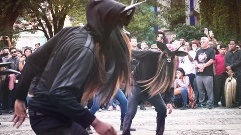 People dancing wearing devil masks Stock Footage 127322871