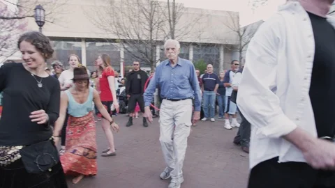 People dancing while the drummers perform Drum circle held Friday evenings Stock Footage 103434006