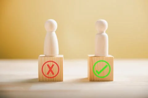 People demonstrate right and wrong on wooden blocks contemplating yes or no Stock Photos