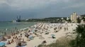 People density on the beach, full of people in holiday, many parasols HD Footage