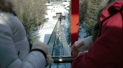 People descending in elevator to ski Stock Footage 18518059