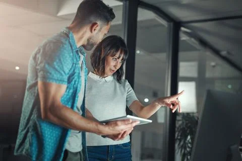People, developer and talking in office with computer, research and testing.. Stock Photos
