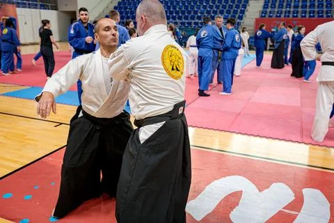 People of different ages practice real aikido technique moves martial arts .. Stock Photos