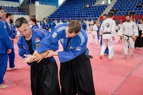 People of different ages practice real aikido technique moves martial arts .. Stock Photos