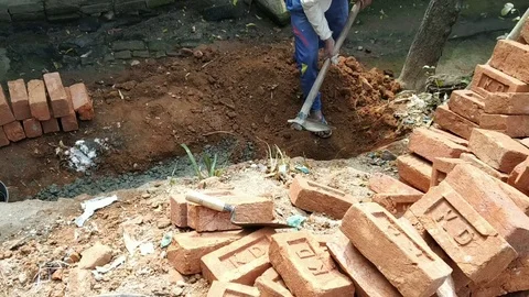 People Digging In The ground to make their home in India Stock Footage 125545092