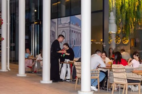 People dining and drinking in a modern restaurant. Russia - 02 August 2026 스톡 사진