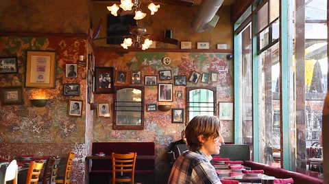 People dining inside &amp; outside - commercial drive Stock Footage 37701564