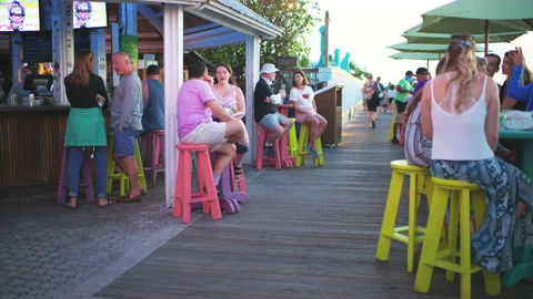 People dining at restaurant bar of Florida Key West Mallory square at sunset Stock Footage 164665442