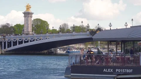 People Dining on Riviera Fuga Floating Terrace by Pont Alexandre III over Seine Stock Footage 339936623