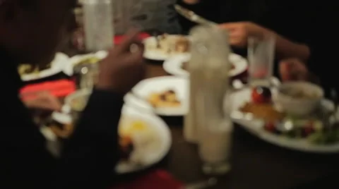 People at a dinner table in a Middle Eastern restaurant Stock Footage 40975441