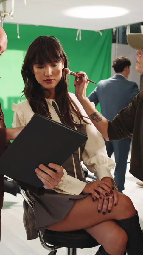 People, director and model in studio with clipboard, screenplay and change Stock Footage 340010715