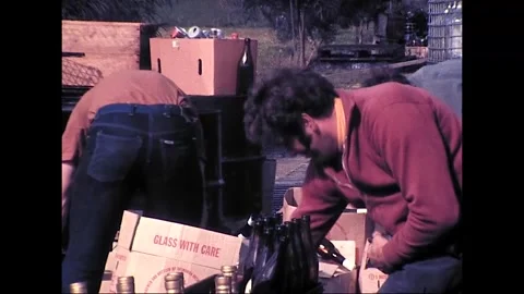 People with Disabilities Sort Glass Bottles for Recycling, 1977 Stock Footage 339870031