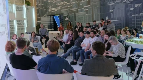 People discussing together about renovation in conference during exhibition Stock Footage