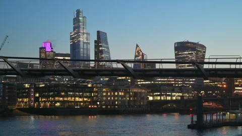 People in the distancing going to work - early morning view of Millennium Bridge Stock Footage 317911673