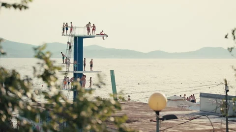 People on Diving Platform Above Adriatic Sea Stock Footage 340067404