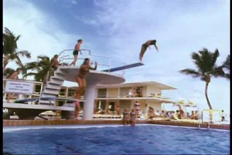 People diving into swimming pool Stock Footage 11350473