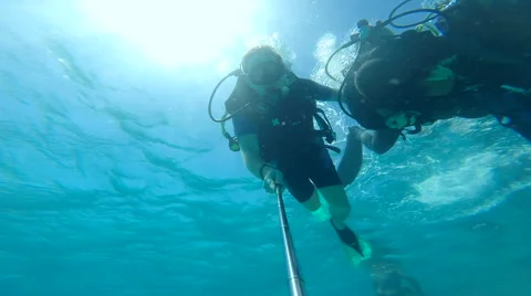 People diving under the warm cyan water. Stock Footage 62534434